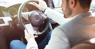 Featured image for “Mobile Phone Use While Driving: Legal Implications You Need to Know [2024 Update]”